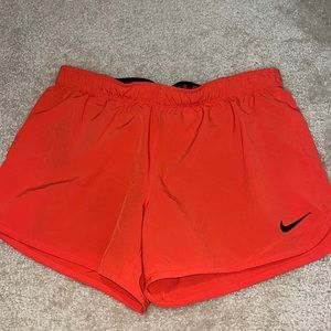 Red Nike shorts